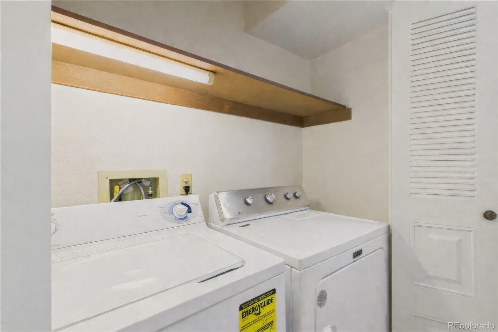 10251 West 44th Avenue, Unit 2203 Wheat Ridge, CO 80033 - Photo 12 of 20 a utility room with dryer and washer