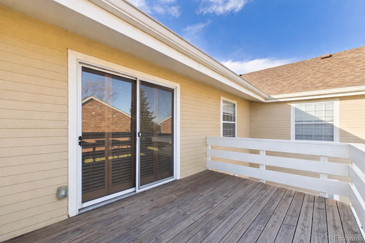 10251 West 44th Avenue, Unit 2203 Wheat Ridge, CO 80033 - Photo 13 of 20 a view of house with wooden floor and windows