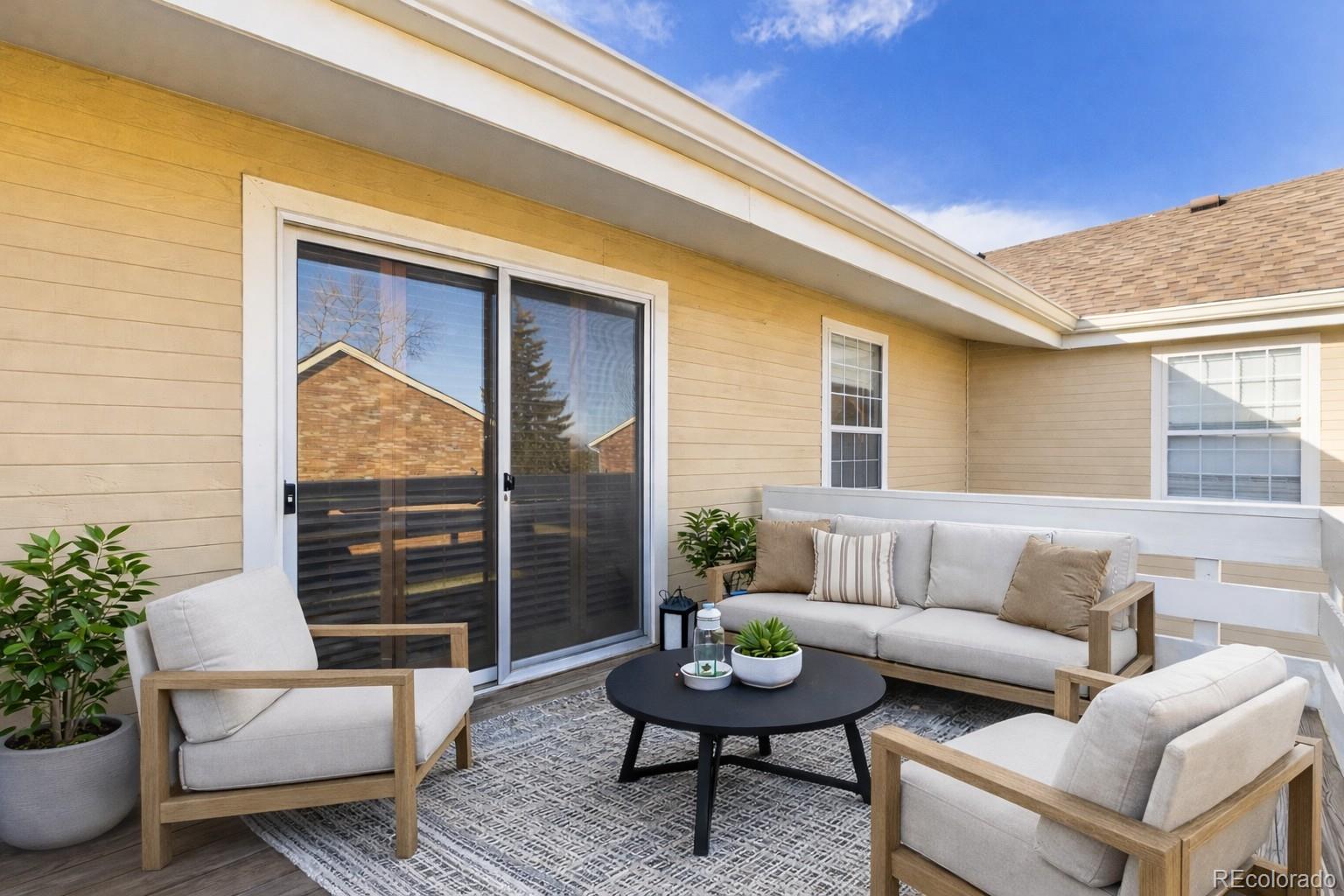 10251 West 44th Avenue, Unit 2203 Wheat Ridge, CO 80033 - Photo 14 of 20 a outdoor living space with furniture and a potted plant