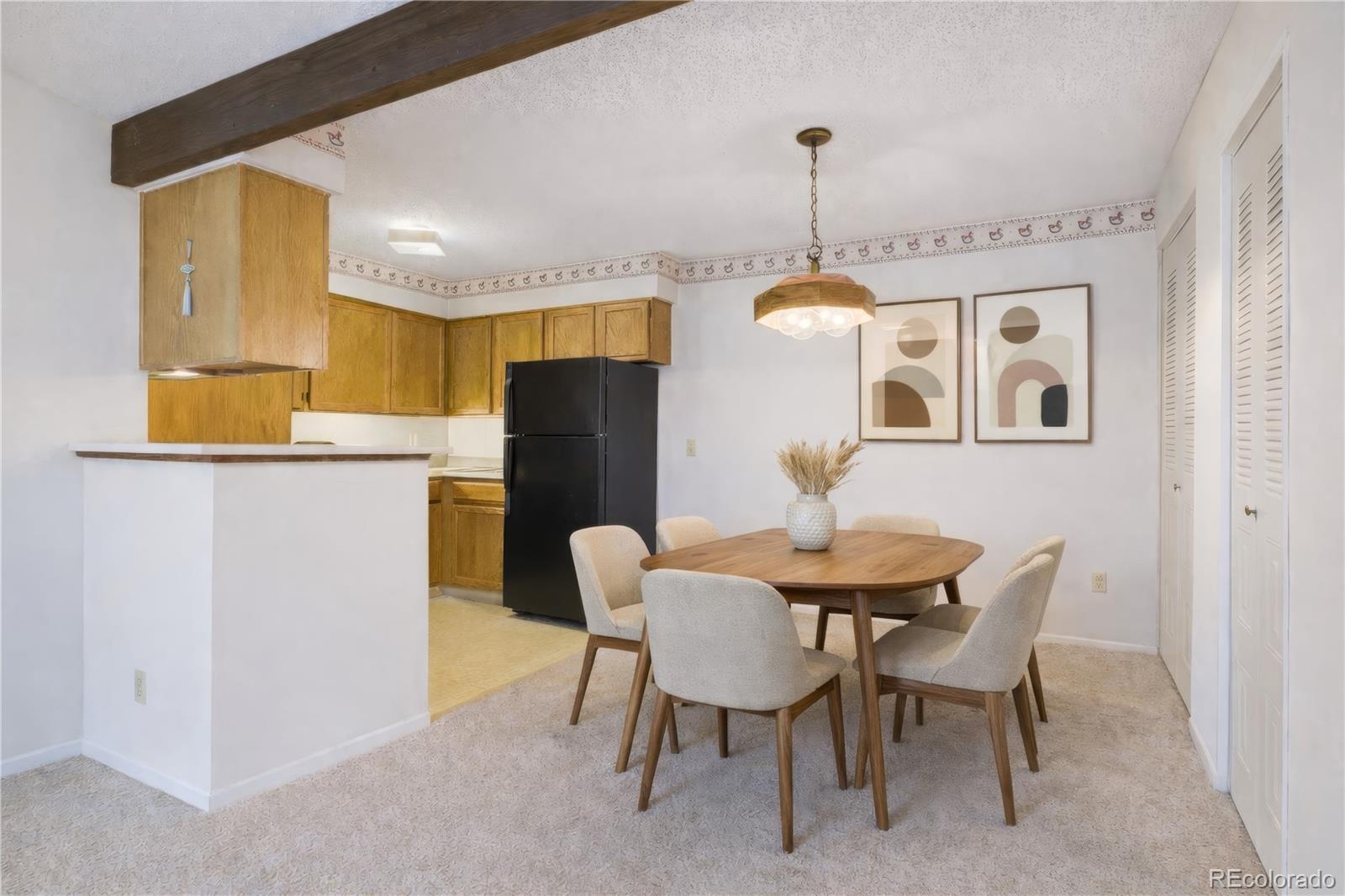 10251 West 44th Avenue, Unit 2203 Wheat Ridge, CO 80033 - Photo 8 of 20 a dining room with furniture and window