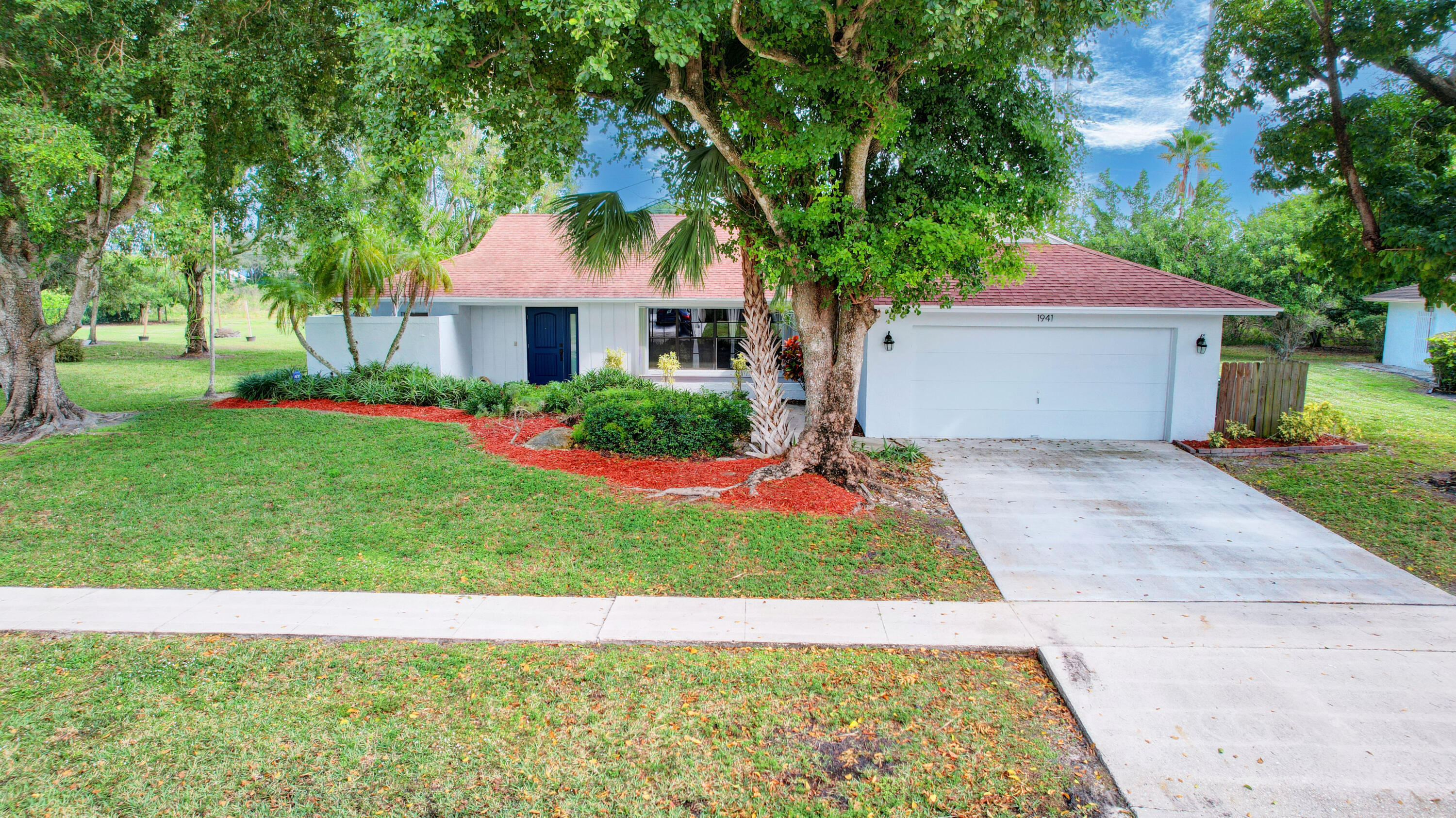 1941 Shower Tree Way Wellington, FL 33414 - Photo 1 of 36 01_house air (1)