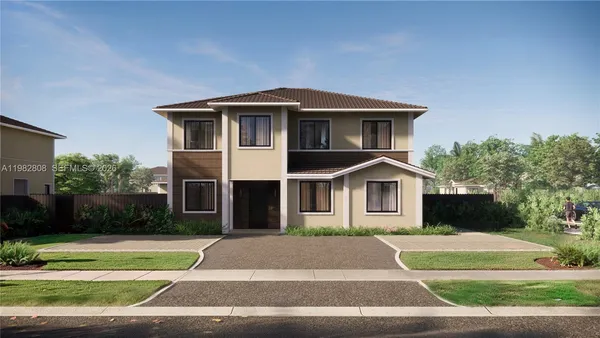 a front view of a house with a yard