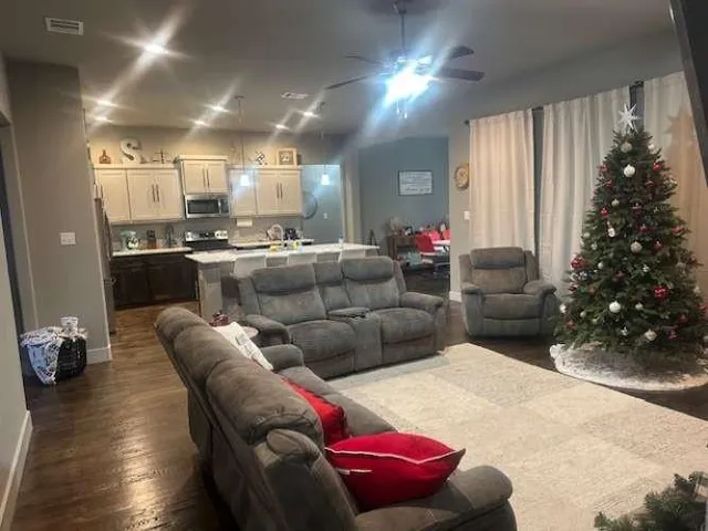 a bedroom with furniture and a window