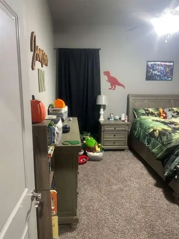 a bedroom with a bed and cabinets