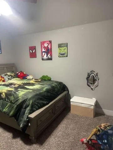 a view of a livingroom with furniture and a flat screen tv