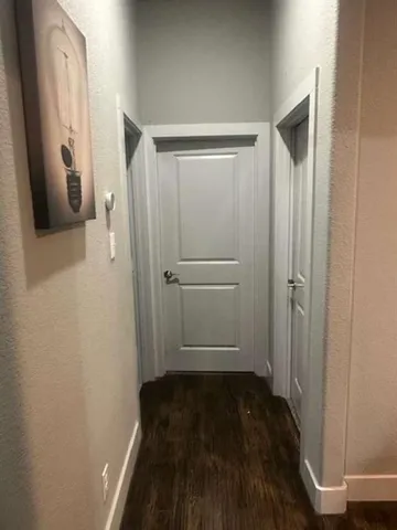 a bedroom with a bed dresser and window