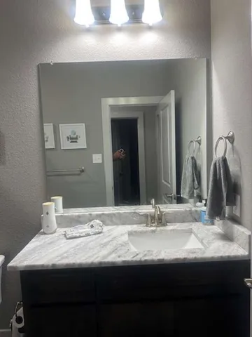 a white toilet sitting next to a shower curtain