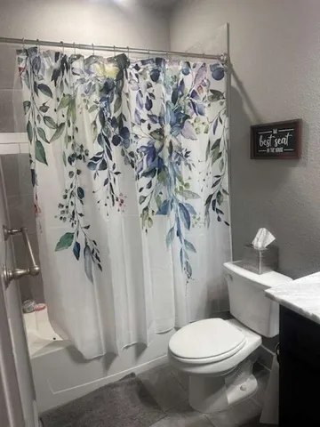 a bathroom with a shower and a tub