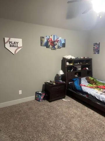 a living room with furniture kitchen view and a chandelier
