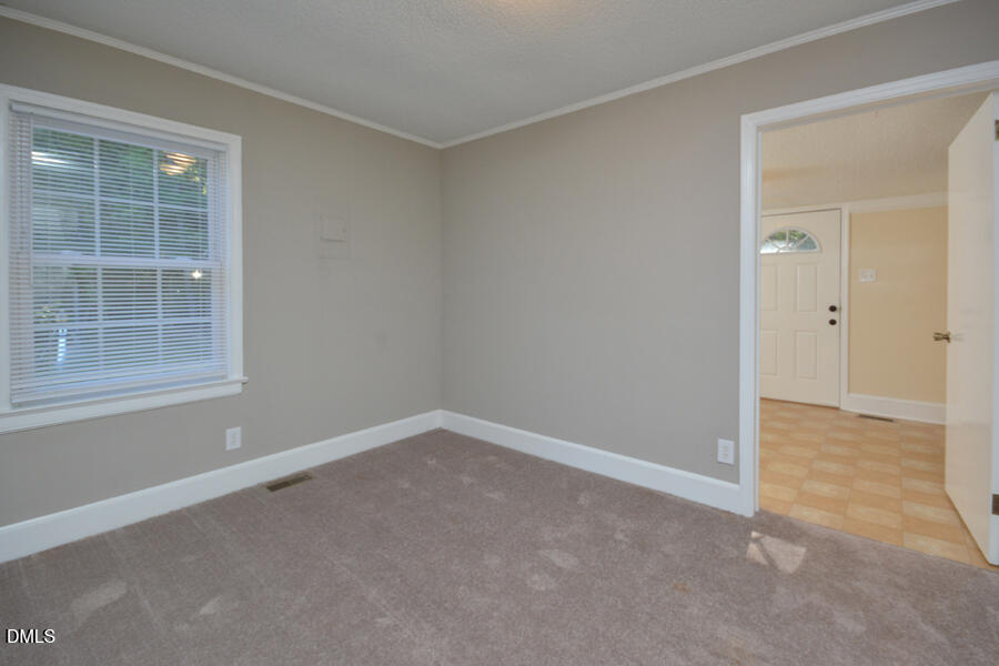 721 Peyton Avenue Durham, NC 27703 - Photo 17 of 25 an empty room with windows