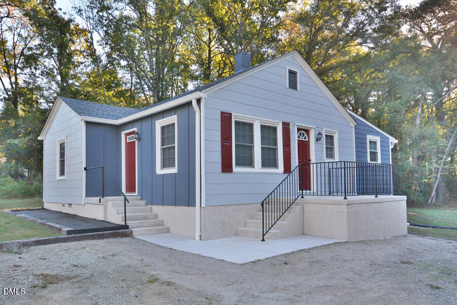 721 Peyton Avenue Durham, NC 27703 - Photo 2 of 25 a front view of house with yard and trees in the background