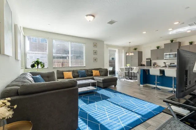 a kitchen with stainless steel appliances a stove a microwave and cabinets