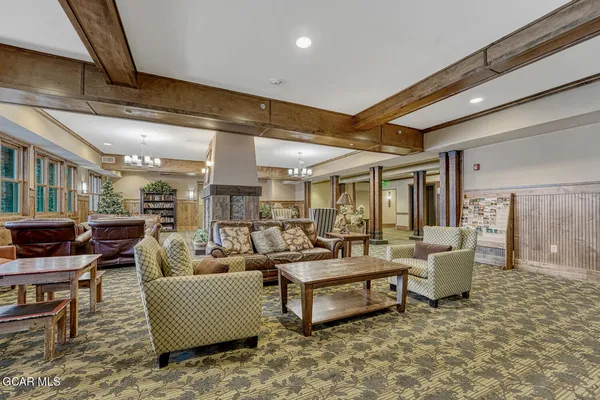 a living room with fireplace furniture and a flat screen tv