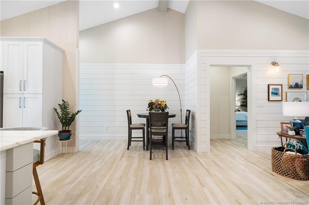 1269 Northwest Fork Road Stuart, FL 34994 - Photo 20 of 92 a dining room with furniture and wooden floor