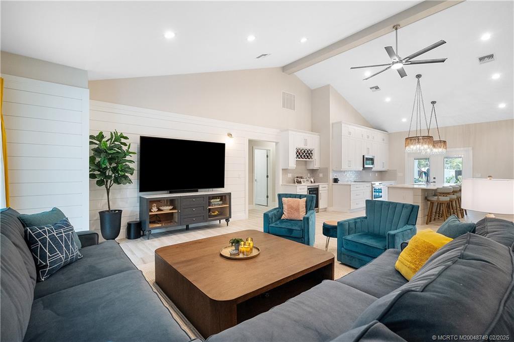 1269 Northwest Fork Road Stuart, FL 34994 - Photo 24 of 92 a living room with furniture and a flat screen tv
