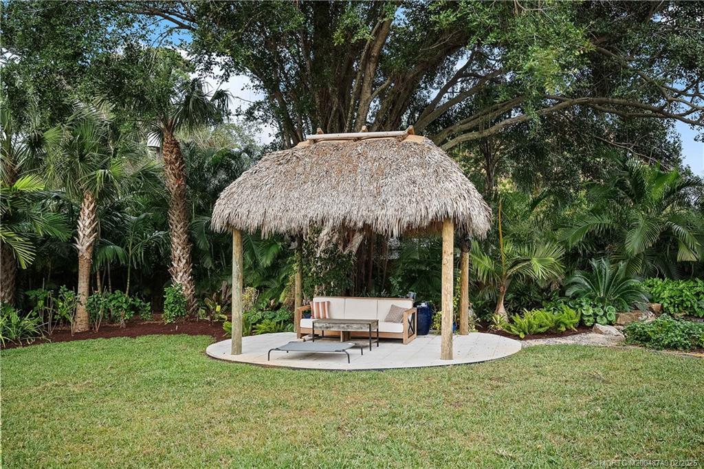 1269 Northwest Fork Road Stuart, FL 34994 - Photo 57 of 92 a view of a house with backyard and trees