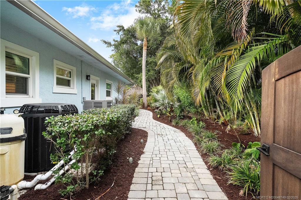 1269 Northwest Fork Road Stuart, FL 34994 - Photo 62 of 92 a front view of a house with a yard
