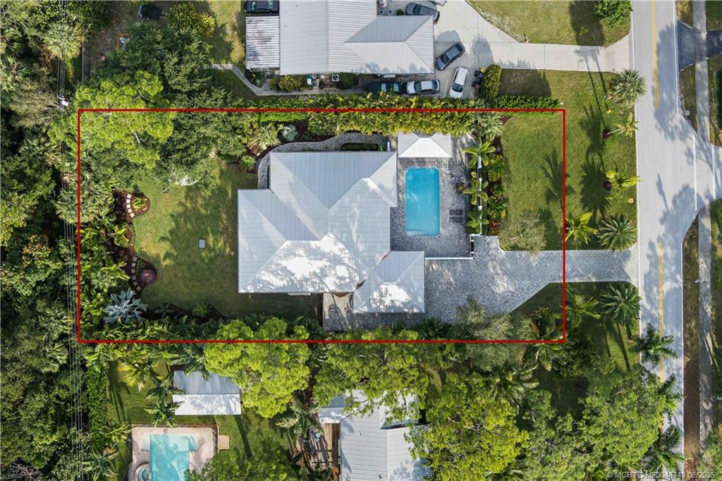 1269 Northwest Fork Road Stuart, FL 34994 - Photo 71 of 92 an aerial view of a house with a yard and garden