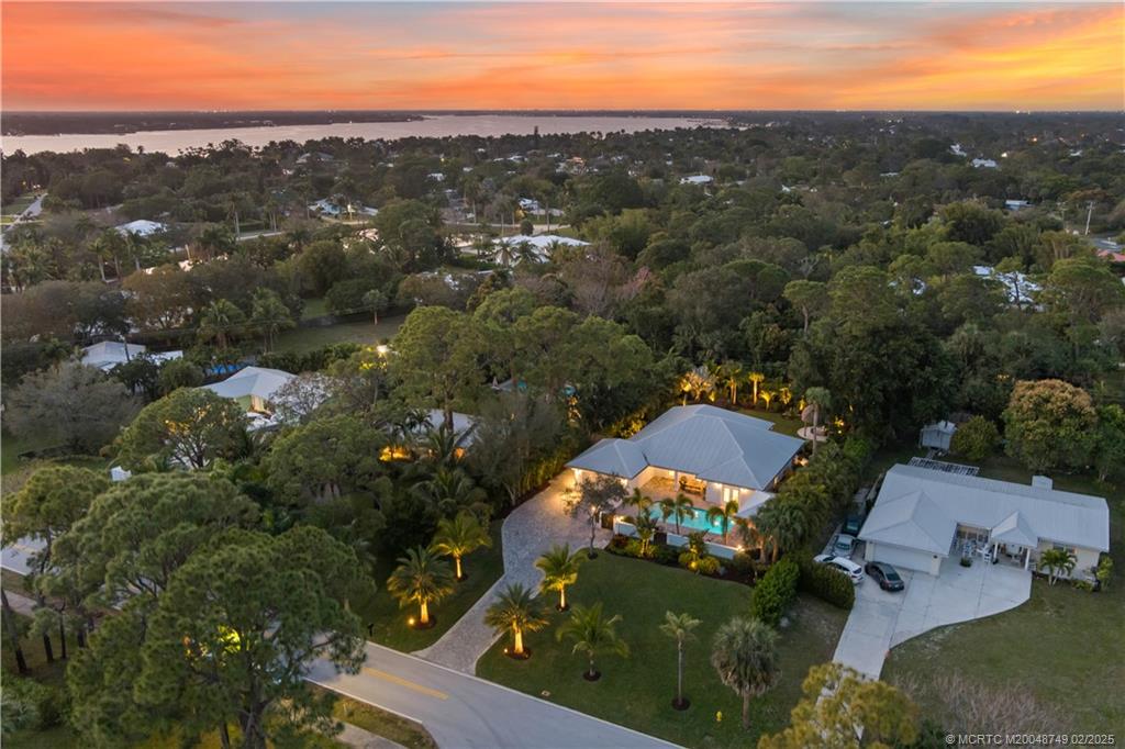 1269 Northwest Fork Road Stuart, FL 34994 - Photo 9 of 92 an aerial view of a houses with a yard