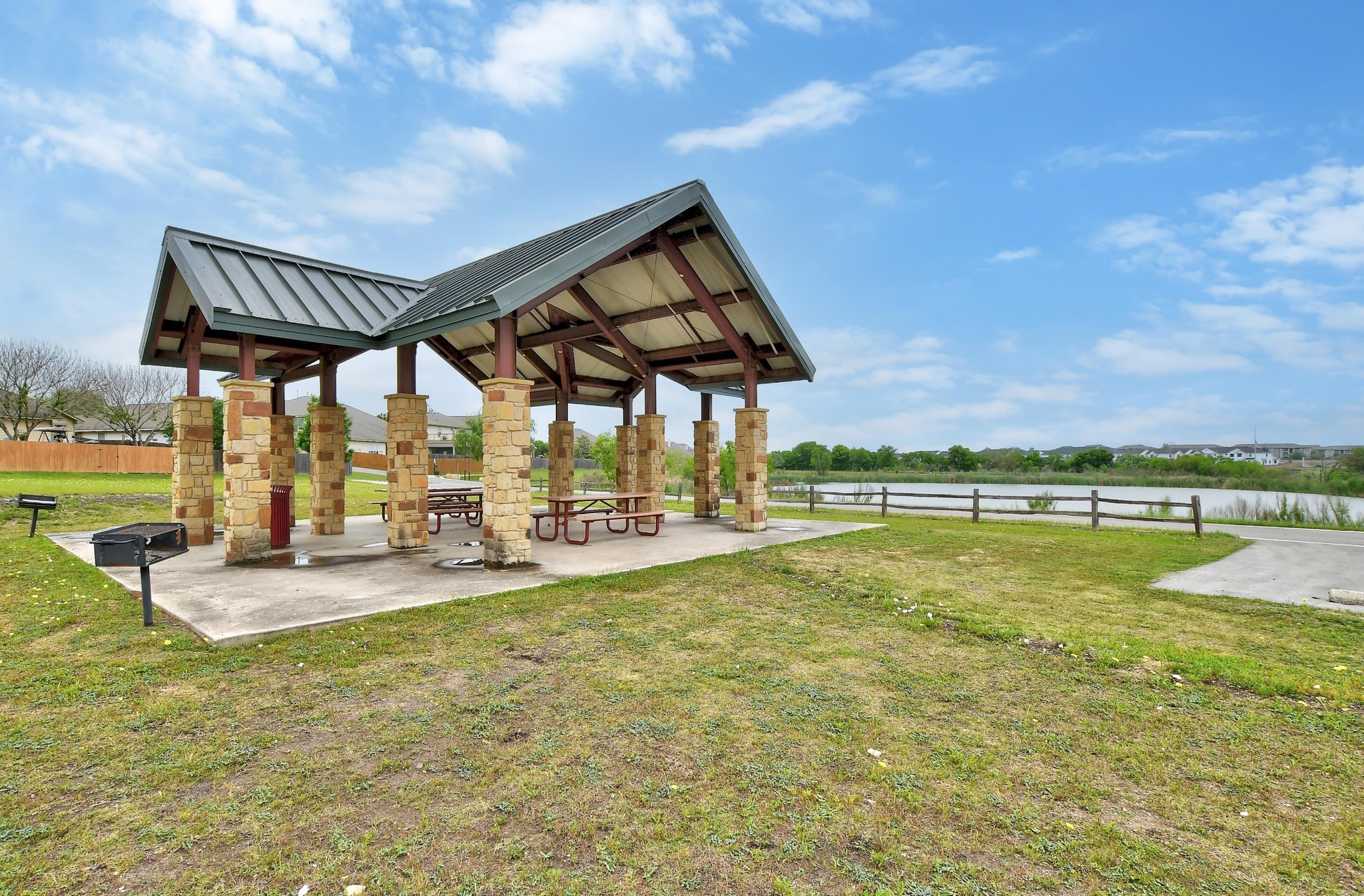 877 Hot Spring Valley Buda, TX 78610 - Photo 32 of 36 a view of a swimming pool with a patio and a yard