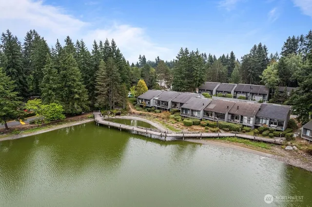 a view of swimming pool with outdoor seating and yard in the back