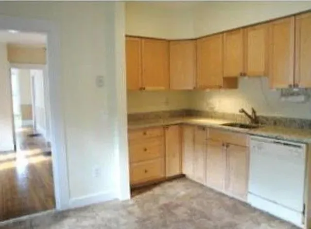 a view of a kitchen with a sink