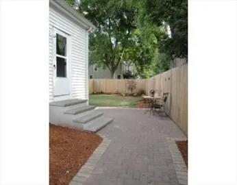 a view of a backyard of the house