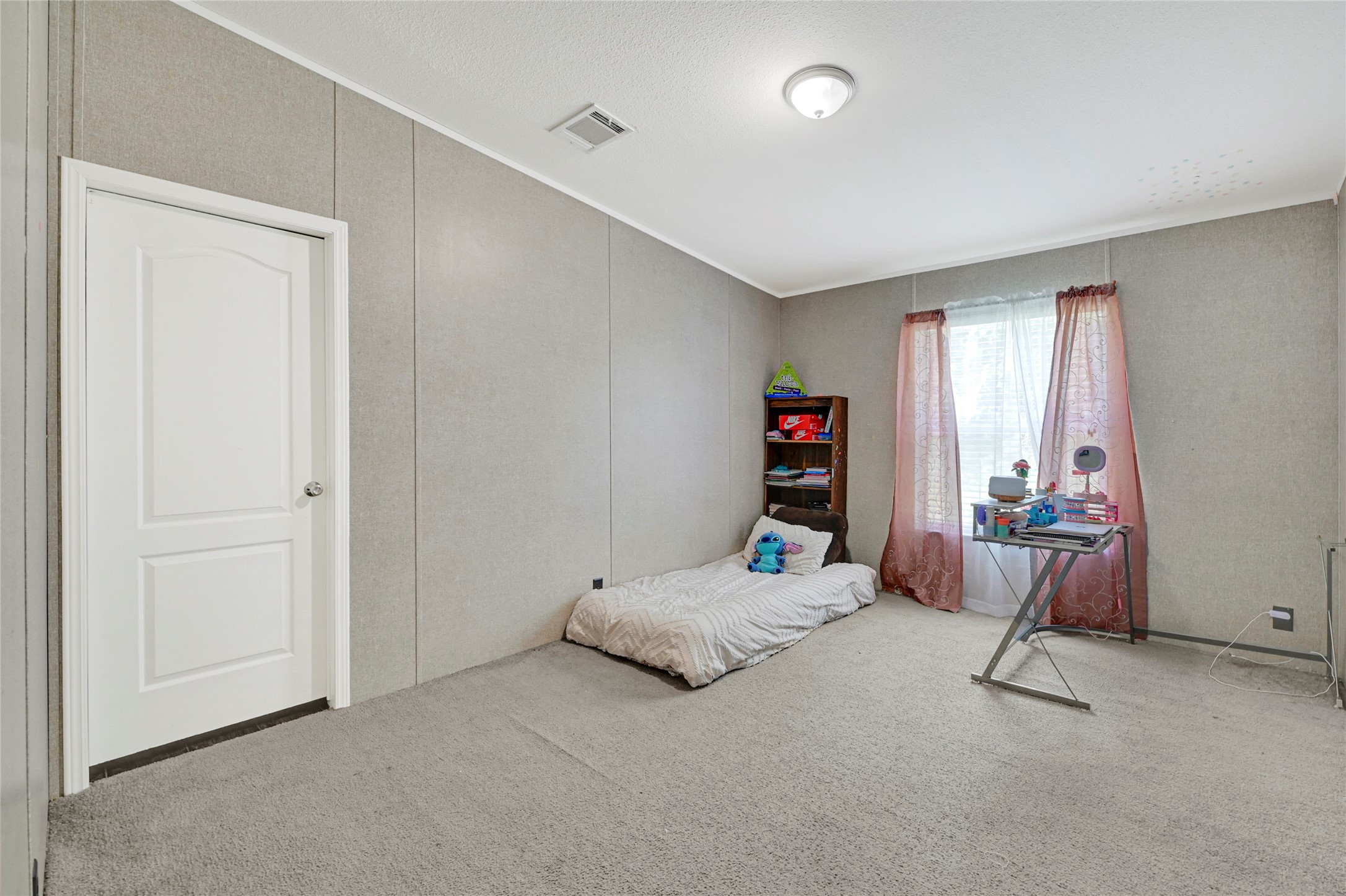 635 County Road 2175 Shepherd, TX 77371 - Photo 21 of 27 a bedroom with a bed and a window