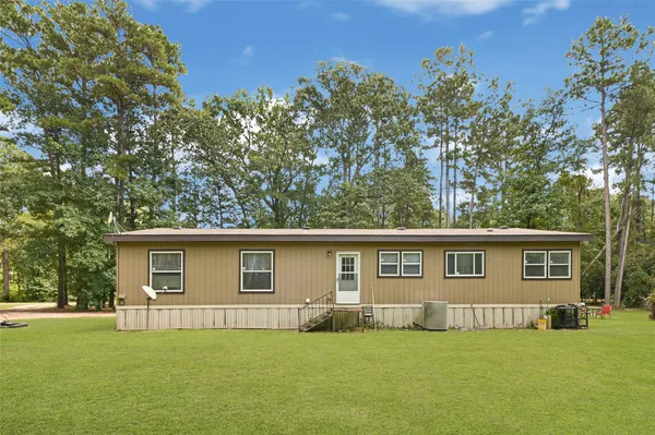 a house with trees in front of it