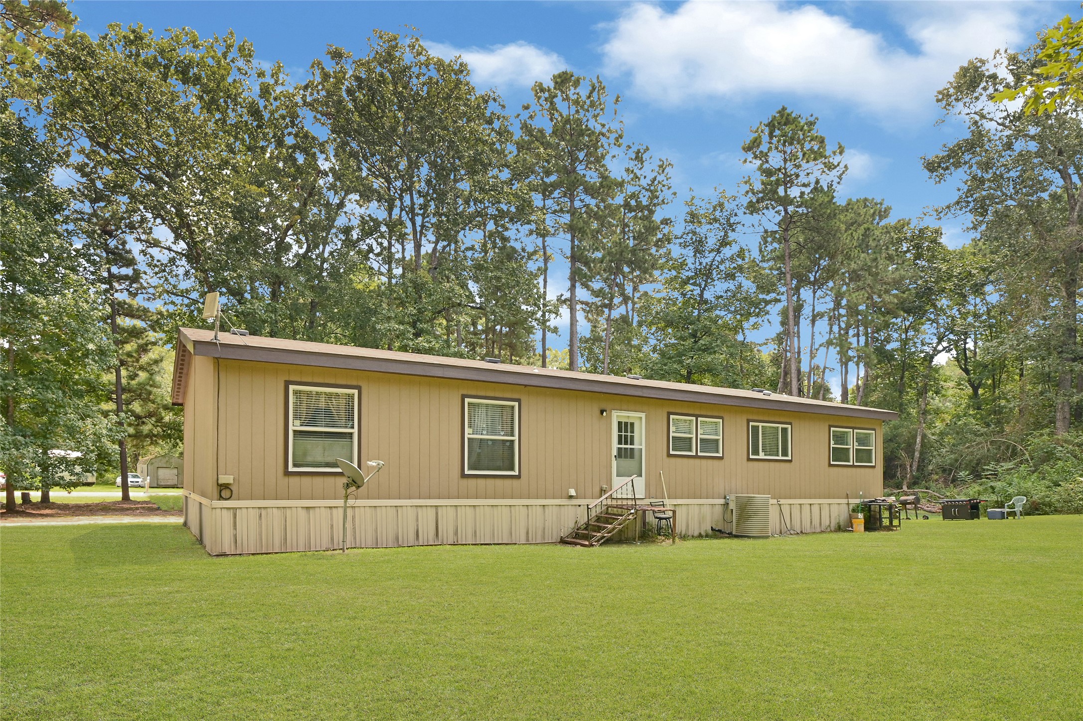 635 County Road 2175 Shepherd, TX 77371 - Photo 25 of 27 a view of a house with a yard