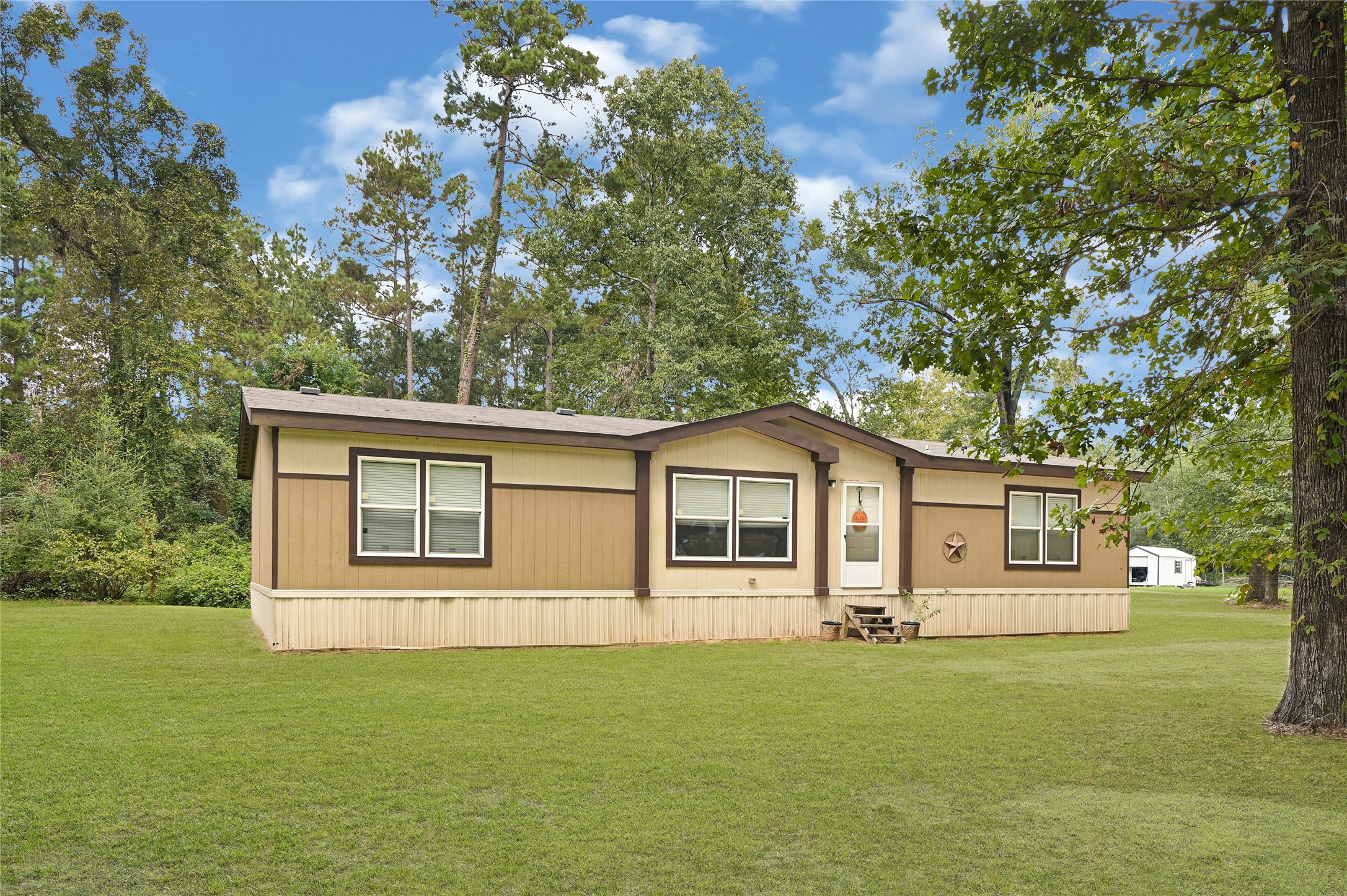 635 County Road 2175 Shepherd, TX 77371 - Photo 27 of 27 a front view of a house with a garden