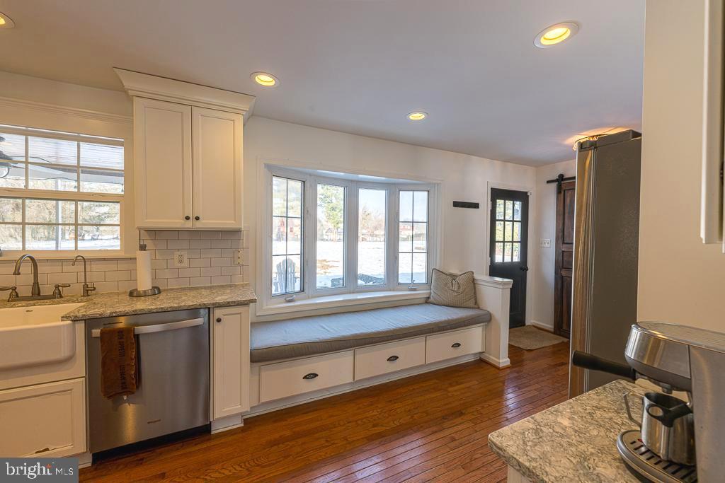 2510 Little River Road Haymarket, VA 20169 - Photo 11 of 39 a large white kitchen with a large window a sink and appliances