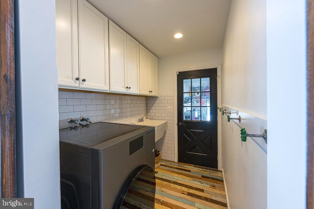 2510 Little River Road Haymarket, VA 20169 - Photo 17 of 39 a utility room with a sink dryer and washer