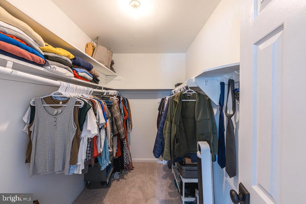 2510 Little River Road Haymarket, VA 20169 - Photo 25 of 39 a view of walk in closet with clothes and shoes