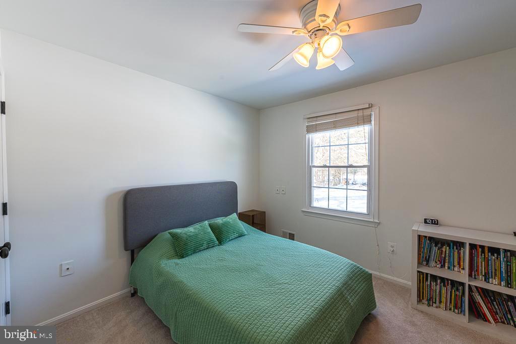 2510 Little River Road Haymarket, VA 20169 - Photo 26 of 39 a bedroom with a bed and a book shelf
