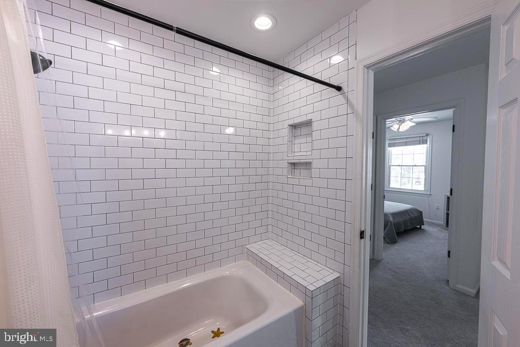 2510 Little River Road Haymarket, VA 20169 - Photo 31 of 39 a bathroom with a bathtub and a shower