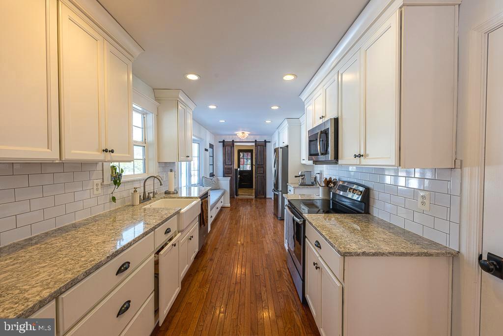2510 Little River Road Haymarket, VA 20169 - Photo 10 of 39 a large kitchen with stainless steel appliances granite countertop a lot of counter space and a sink