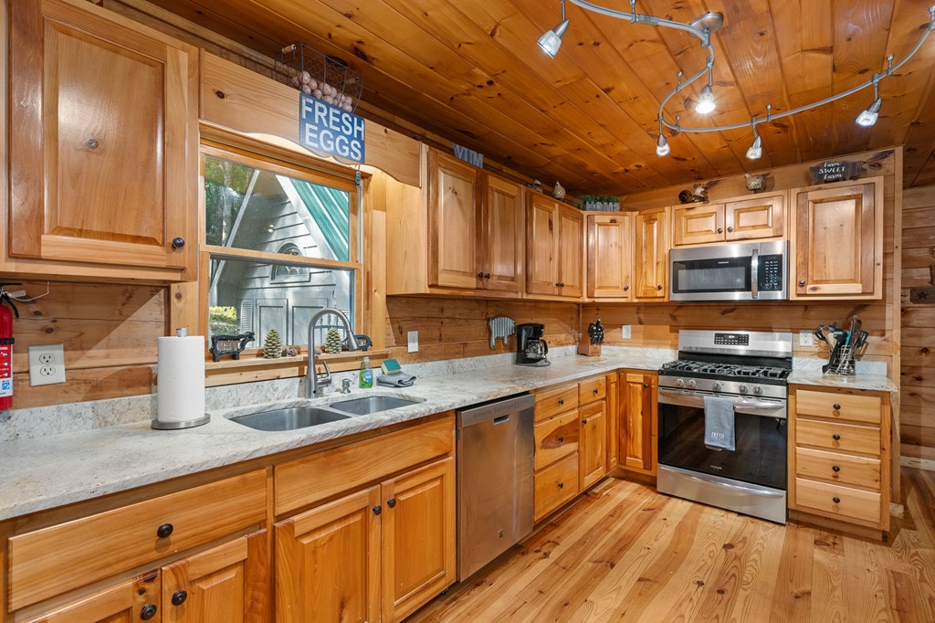 93 Amy Lane Ellijay, GA 30540 - Photo 13 of 61 a kitchen with stainless steel appliances granite countertop a stove sink and cabinets