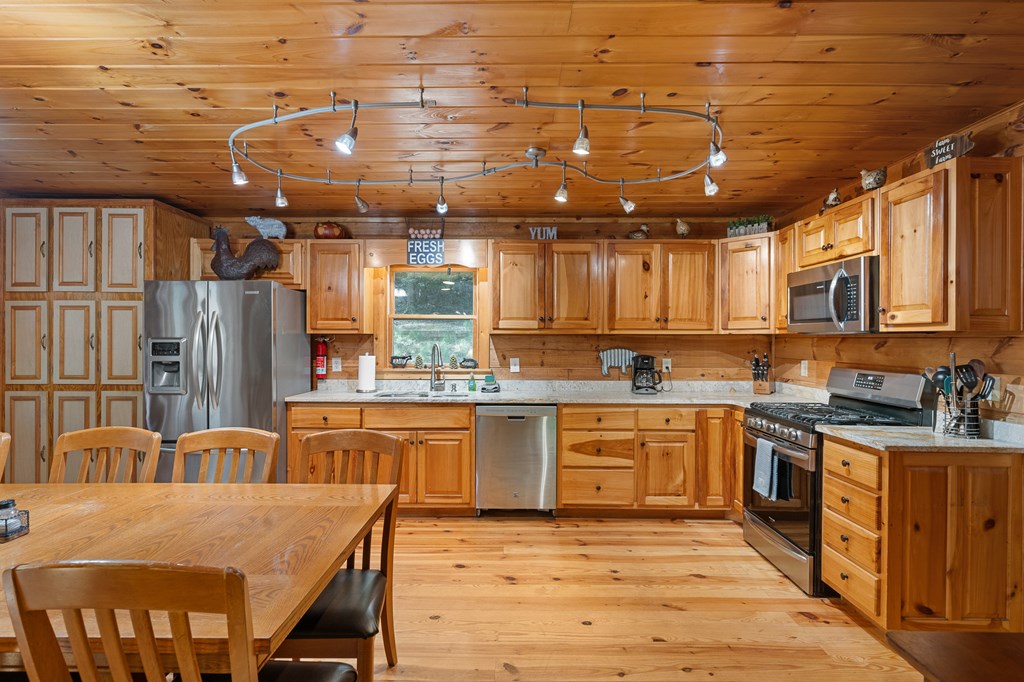 93 Amy Lane Ellijay, GA 30540 - Photo 16 of 61 a kitchen with stainless steel appliances granite countertop a sink window and cabinets
