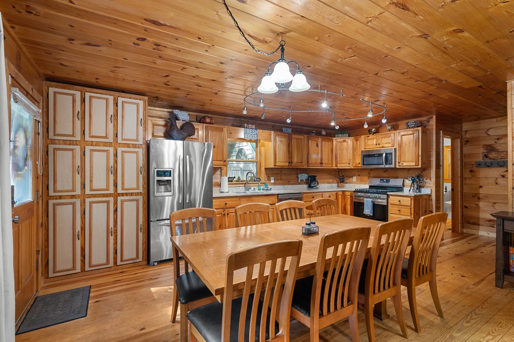 93 Amy Lane Ellijay, GA 30540 - Photo 17 of 61 a view of a dining room with furniture window and wooden floor