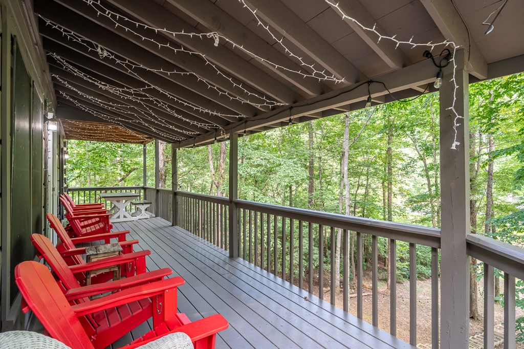 93 Amy Lane Ellijay, GA 30540 - Photo 23 of 61 a balcony with lots of trees in front of it