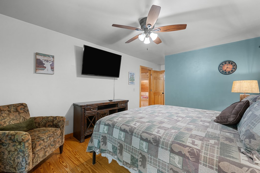 93 Amy Lane Ellijay, GA 30540 - Photo 34 of 61 a bedroom with a bed and a flat screen tv