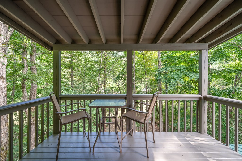 93 Amy Lane Ellijay, GA 30540 - Photo 35 of 61 a view of a two chairs in the deck next to a yard