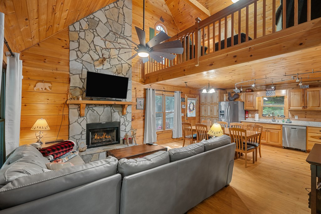 93 Amy Lane Ellijay, GA 30540 - Photo 10 of 61 a living room with furniture a fireplace and a flat screen tv