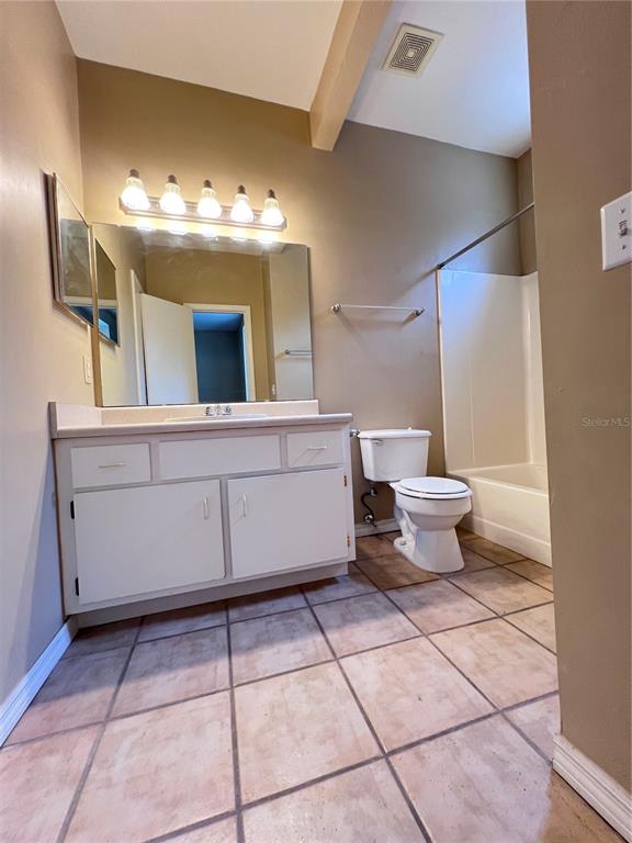 4700 Southwest Archer Road, Unit M90 Gainesville, FL 32608 - Photo 16 of 35 a bathroom with a sink a toilet and mirror