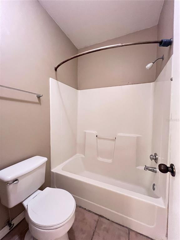 4700 Southwest Archer Road, Unit M90 Gainesville, FL 32608 - Photo 20 of 35 a white toilet sitting next to a bath tub