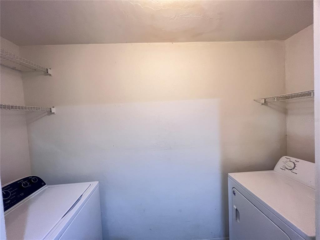 4700 Southwest Archer Road, Unit M90 Gainesville, FL 32608 - Photo 24 of 35 a utility room with dryer and washer