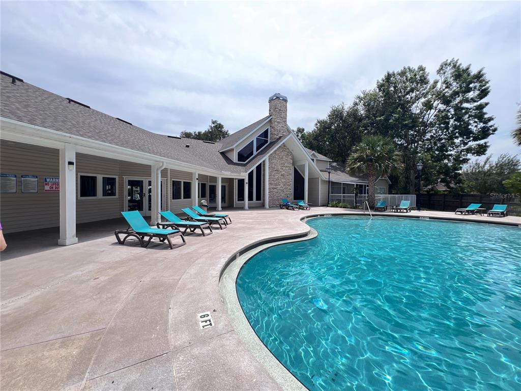 4700 Southwest Archer Road, Unit M90 Gainesville, FL 32608 - Photo 26 of 35 a view of a house with backyard and porch