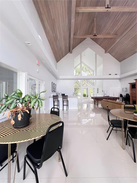 4700 Southwest Archer Road, Unit M90 Gainesville, FL 32608 - Photo 30 of 35 a dining room with furniture and wooden floor