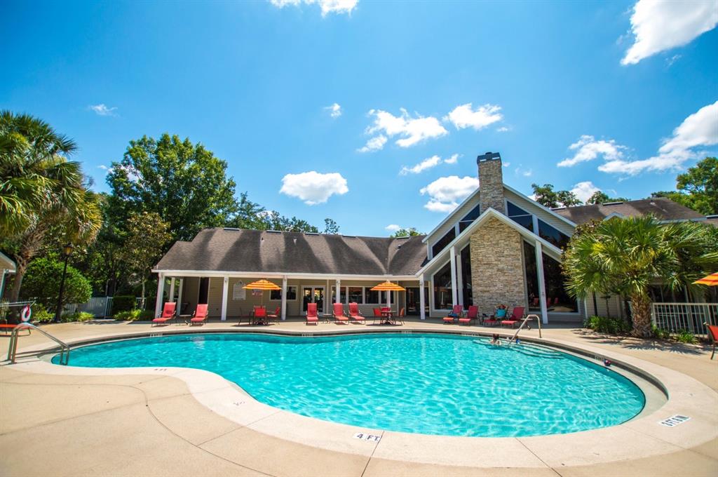 4700 Southwest Archer Road, Unit M90 Gainesville, FL 32608 - Photo 3 of 35 a view of house with swimming pool outdoor seating